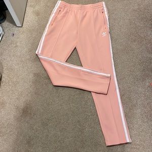 Adidas coral size small. Tapered ankle with zipper